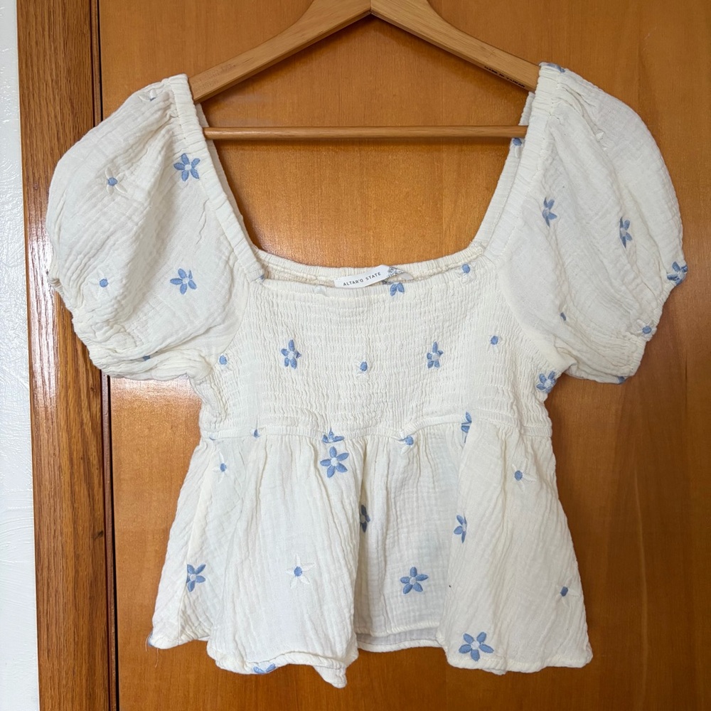 Altar’d StateSmocked Puff Sleeve Peplum Top in Cream with Blue Floral Embroidery
